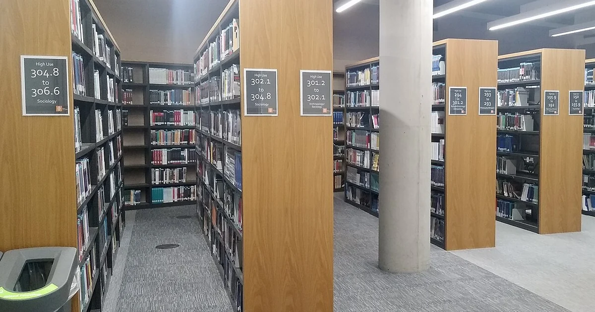 Books on library shelves, Davison Building, Royal Holloway University of London, Surrey, in September 2026