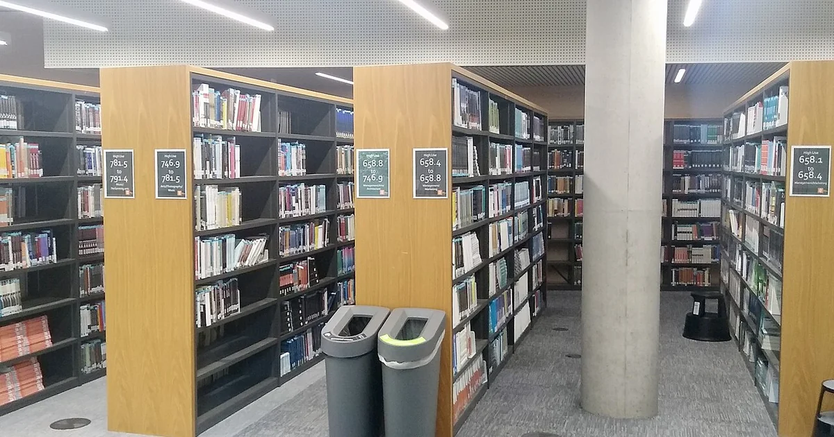 Books on library shelves, Davison Building, Royal Holloway University of London, Surrey, in September 2026