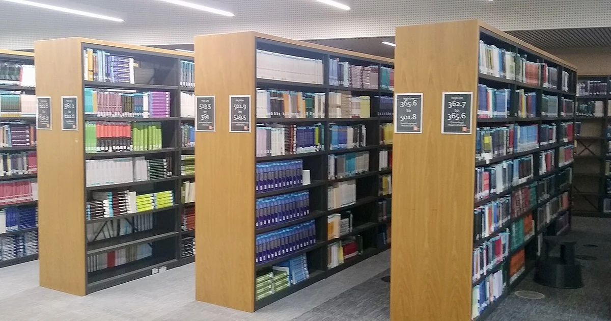 Books on library shelves, Davison Building, Royal Holloway University of London, Surrey, in September 2026