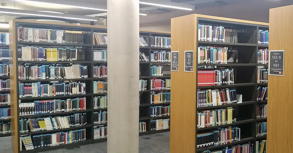 Books on library shelves, Davison Building, Royal Holloway University of London, Surrey, in September 2026