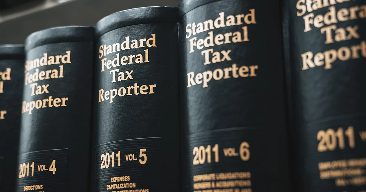Legal books at a law library ---- Standai Federa Standard Federal Standard Тах Report andard Federal d ederal Tax Reporter Tax Tax Reporter r Reporter 2014" 2011 vol 5 2011 vol. 6 2011 VOL 4 HOME BUGATIONS BRUCTIONS DEPRECIATION TRISUTIONS